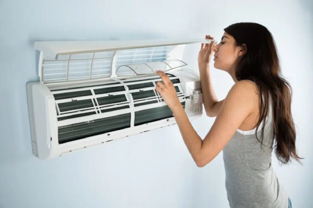 Technician protecting an HVAC system from power surges